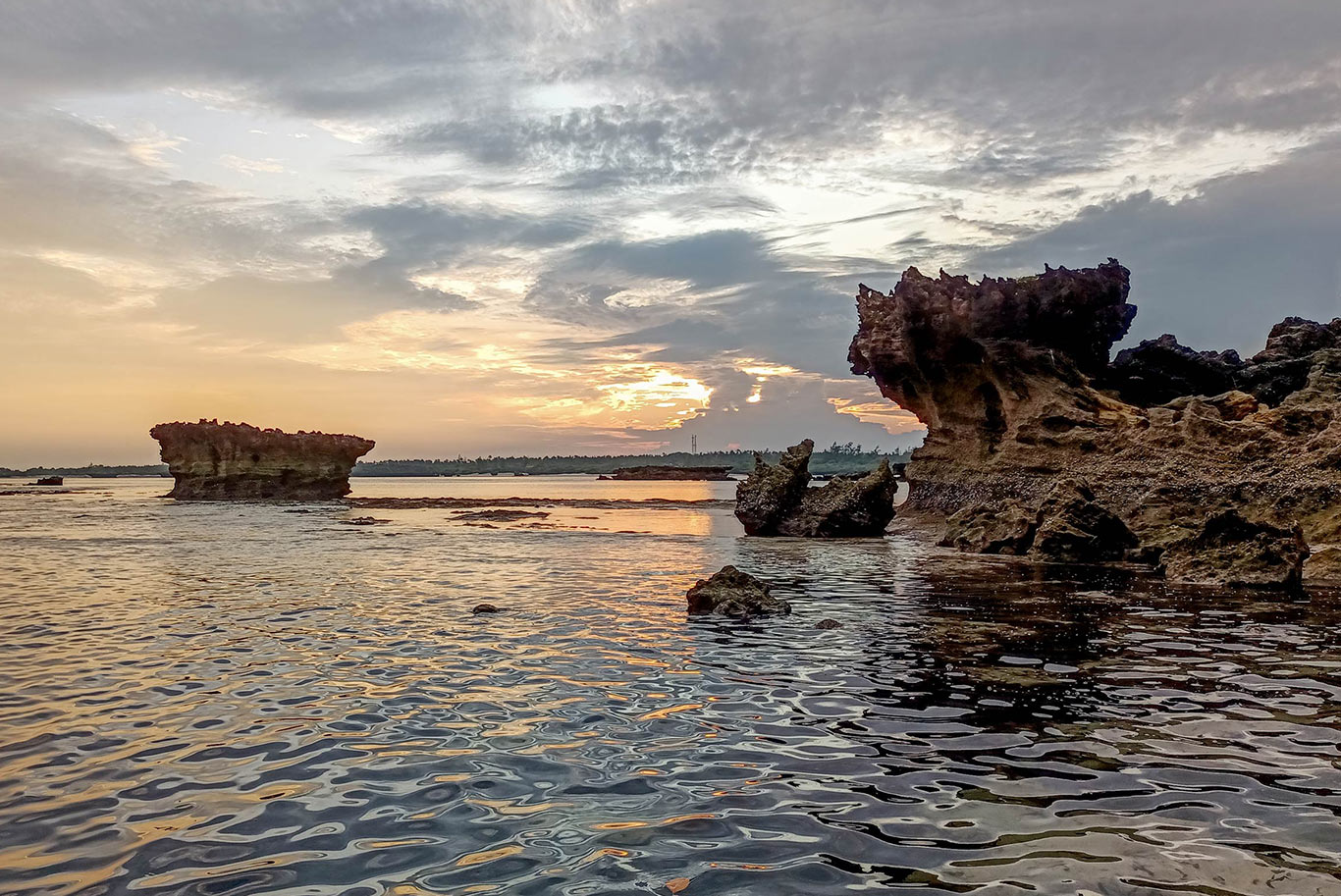 Rocky coast with water, sunset view